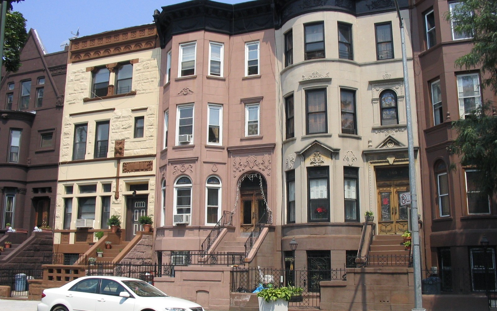 A row of brownstones in Bedford-Stuyvesant, Brooklyn, a neighborhood where deed theft complaints are concentrated.