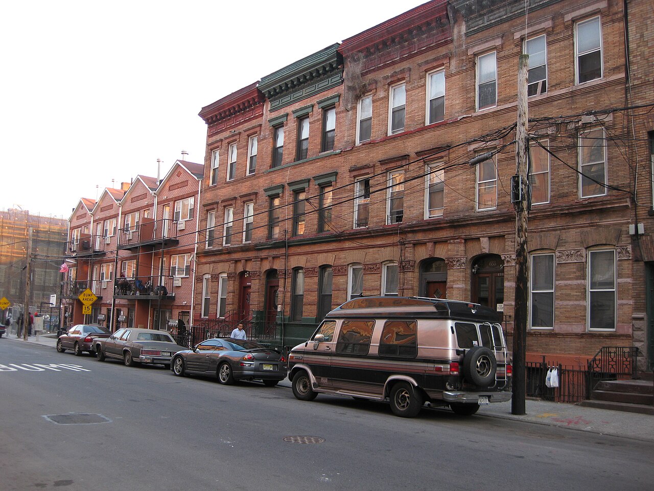 Weathered brick tenement buildings on a Mott Haven street in the Bronx — the kind of rent-stabilized walk-ups dominated by New York's worst-ranked landlords.